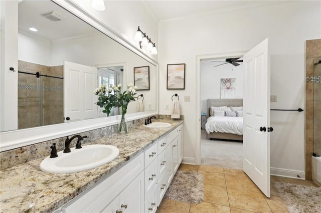 28 Wax Myrtle Ln, Covington, LA 70433 - full bathroom featuring double vanity, a tile shower, ornamental molding, tile patterned floors, and connected bathroom