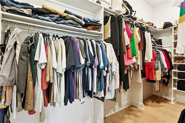 28 Wax Myrtle Ln, Covington, LA 70433 - walk in closet with wood finished floors