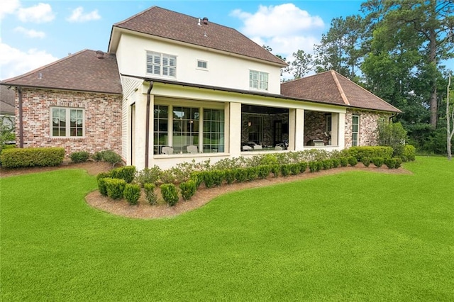 28 Wax Myrtle Ln, Covington, LA 70433 - rear view of property with a lawn, a shingled roof, and brick siding