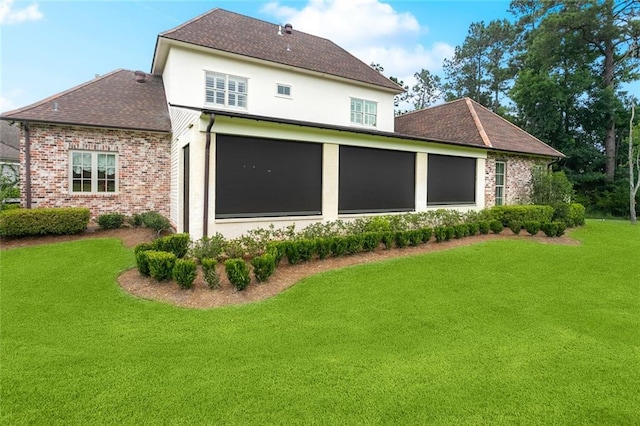 28 Wax Myrtle Ln, Covington, LA 70433 - rear view of property with a lawn, brick siding, and a shingled roof