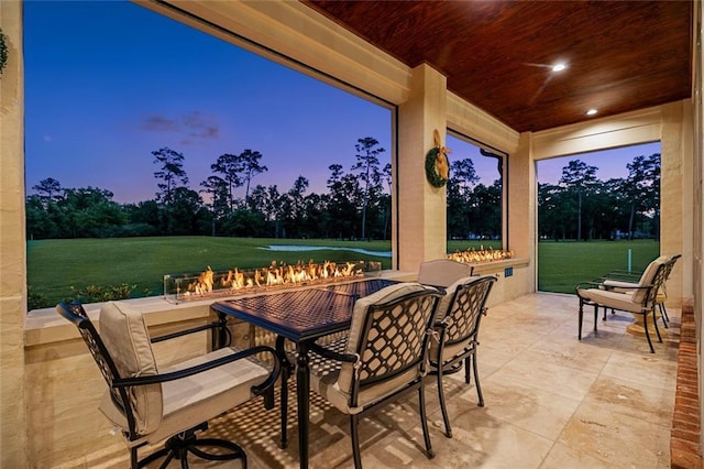 28 Wax Myrtle Ln, Covington, LA 70433 - patio terrace at dusk featuring a patio area, outdoor dining space, and a yard