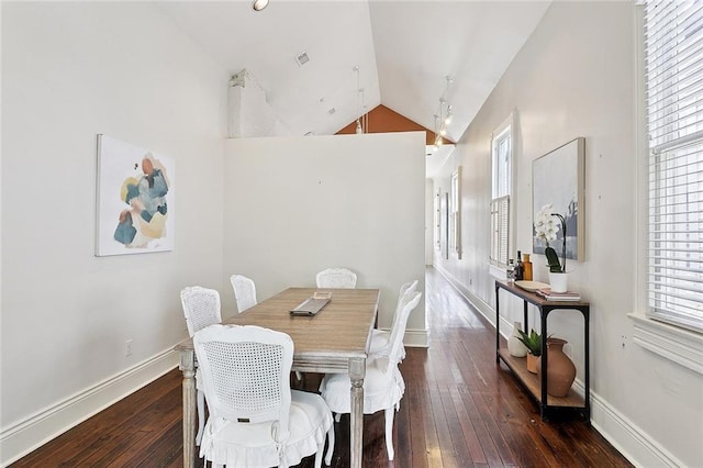 1208 Joseph St, New Orleans, LA 70115 - dining space featuring wood-type flooring, high vaulted ceiling, and baseboards