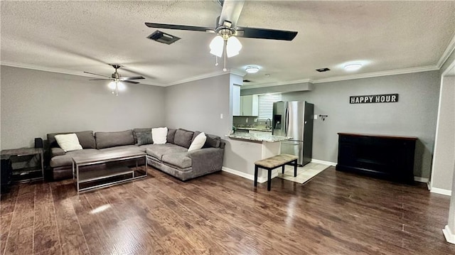 1813 Green Oak Dr, Gretna, LA 70056 - living room with ceiling fan, a textured ceiling, dark wood finished floors, and ornamental molding
