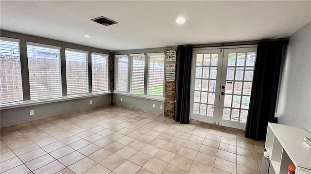 1813 Green Oak Dr, Gretna, LA 70056 - unfurnished room featuring light tile patterned floors, recessed lighting, and french doors