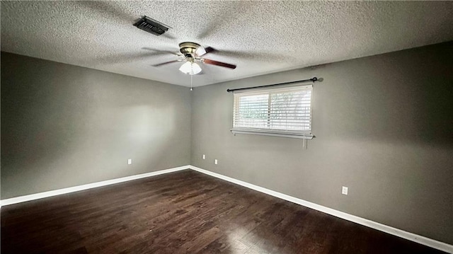 1813 Green Oak Dr, Gretna, LA 70056 - unfurnished room with a ceiling fan, dark wood finished floors, and a textured ceiling