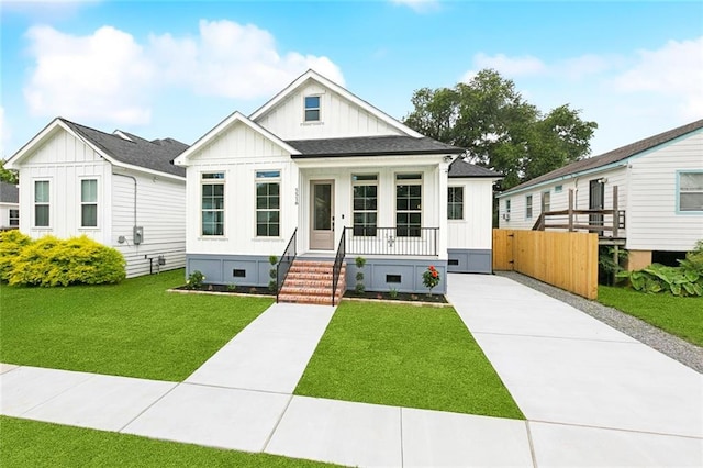 5516 Warrington Dr, New Orleans, LA 70122 - modern inspired farmhouse featuring covered porch, board and batten siding, crawl space, and concrete driveway