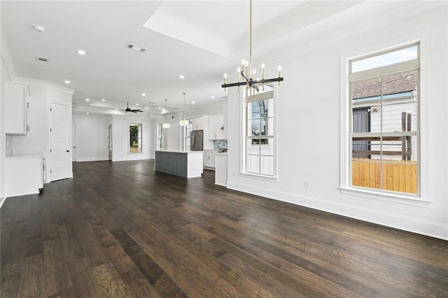 5516 Warrington Dr, New Orleans, LA 70122 - unfurnished living room featuring a chandelier, dark wood-style floors, baseboards, recessed lighting, and a ceiling fan