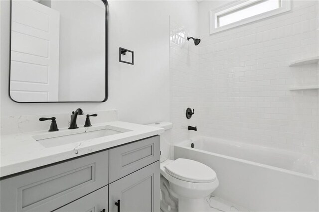 5516 Warrington Dr, New Orleans, LA 70122 - bathroom featuring toilet, vanity, and shower / bath combination