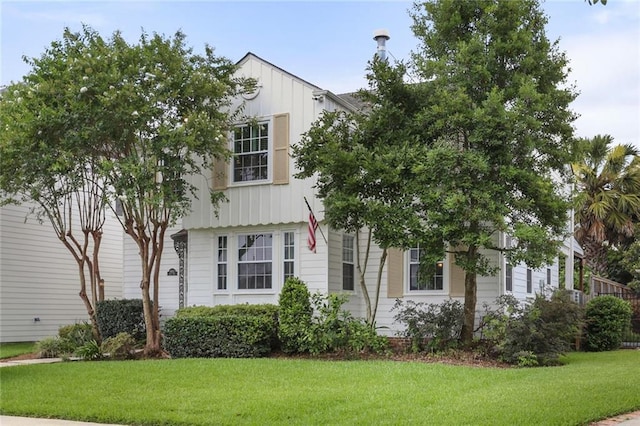 6035 Louis Xiv St, New Orleans, LA 70124 - view of front of home with board and batten siding and a front yard