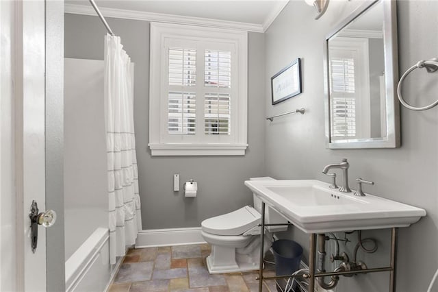 6035 Louis Xiv St, New Orleans, LA 70124 - bathroom featuring stone finish flooring, crown molding, toilet, baseboards, and shower / bath combination with curtain