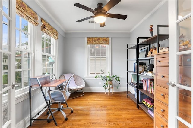 6035 Louis Xiv St, New Orleans, LA 70124 - home office featuring light wood-type flooring, crown molding, baseboards, french doors, and a ceiling fan