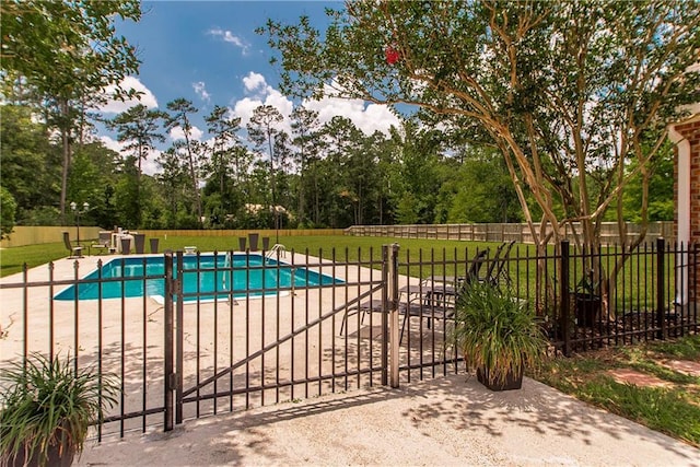 42251 Jefferson Dr, Hammond, LA 70403 - view of swimming pool with a patio and a gate