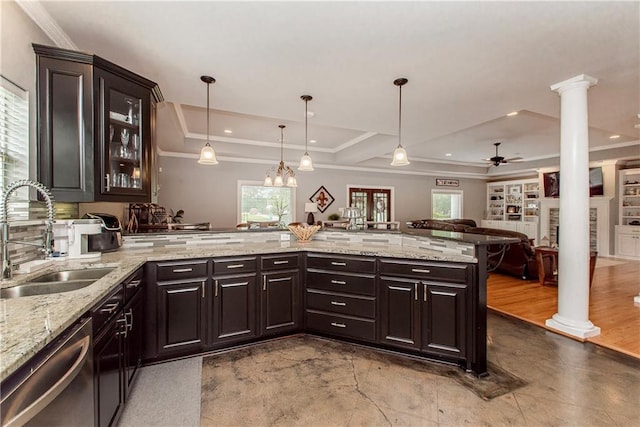 42251 Jefferson Dr, Hammond, LA 70403 - kitchen featuring a sink, dishwasher, ornate columns, a tray ceiling, and crown molding