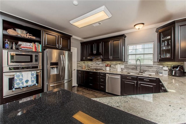 42251 Jefferson Dr, Hammond, LA 70403 - kitchen with appliances with stainless steel finishes, a sink, ornamental molding, light stone countertops, and backsplash