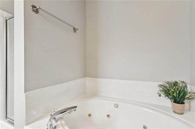 70323 11th St, Covington, LA 70433 - bathroom featuring a jetted tub and a stall shower