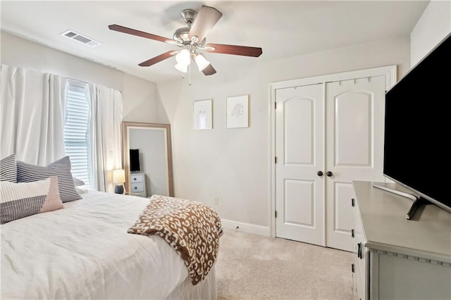 70323 11th St, Covington, LA 70433 - bedroom with light carpet, ceiling fan, a closet, and baseboards