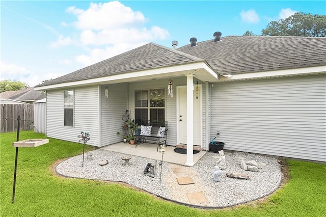 70323 11th St, Covington, LA 70433 - back of property featuring a shingled roof and a patio