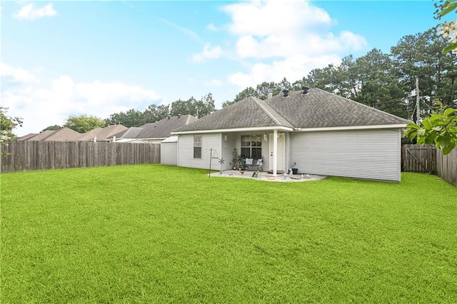 70323 11th St, Covington, LA 70433 - rear view of house featuring a patio area and a shingled roof