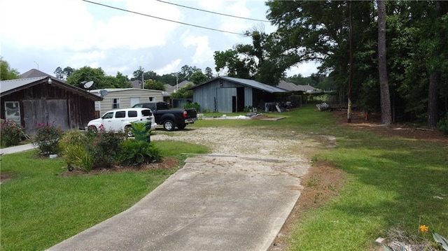 17345,17347,17351 Old Covington Highway, Hammond, LA 70403 - view of front of house with a front lawn and concrete driveway