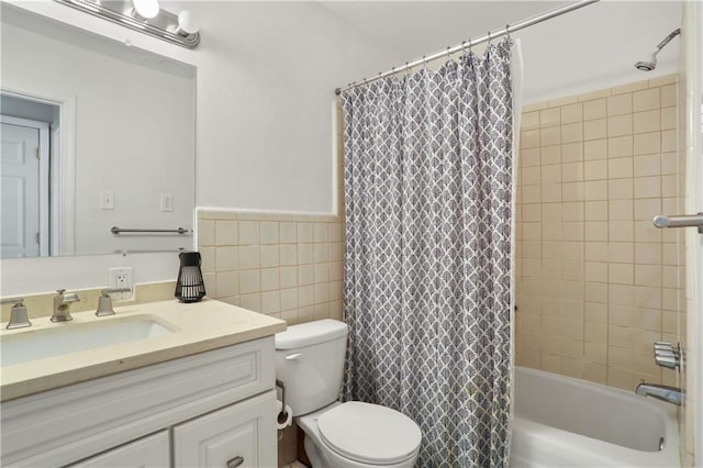 732 Cherokee St Unit 305, New Orleans, LA 70118 - full bathroom featuring vanity, shower / bath combo with shower curtain, tile walls, and wainscoting