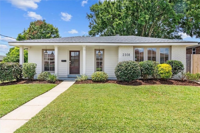 2308 Taft Park, Metairie, LA 70001 - ranch-style home with brick siding, a shingled roof, and a porch
