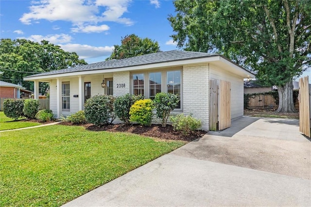 2308 Taft Park, Metairie, LA 70001 - ranch-style home with brick siding, driveway, and roof with shingles