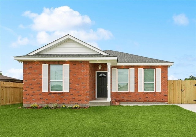 5011 Hauck Dr, New Orleans, LA 70127 - view of front facade with brick siding and a shingled roof
