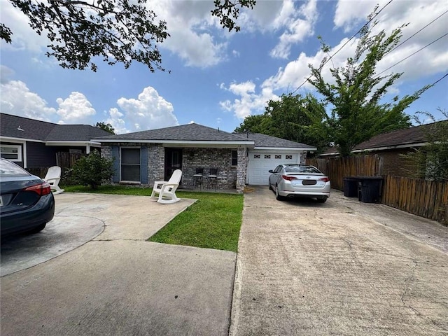 314 W Bordelon St, Gonzales, LA 70737 - ranch-style house with driveway, a garage, and brick siding