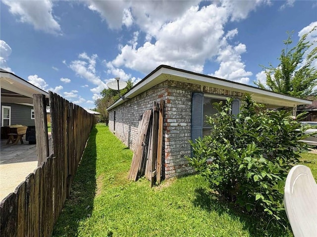 314 W Bordelon St, Gonzales, LA 70737 - view of side of property featuring brick siding