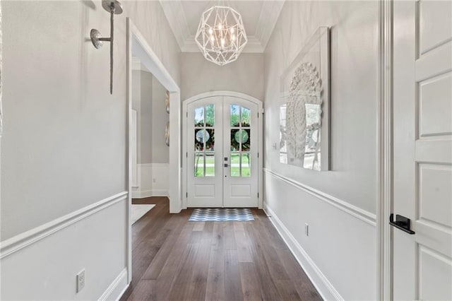331 Memphis Trce, Covington, LA 70433 - foyer entrance featuring french doors, a chandelier, dark wood-type flooring, and ornamental molding