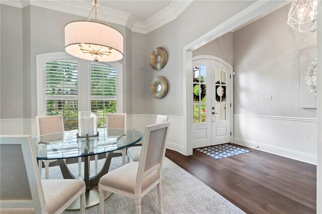 331 Memphis Trce, Covington, LA 70433 - dining room featuring dark wood finished floors and ornamental molding