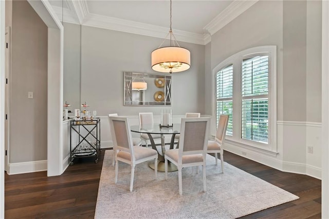 331 Memphis Trce, Covington, LA 70433 - dining room with dark wood finished floors, crown molding, and baseboards