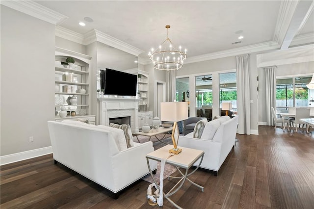 331 Memphis Trce, Covington, LA 70433 - living area featuring a fireplace, crown molding, baseboards, a chandelier, and dark wood finished floors