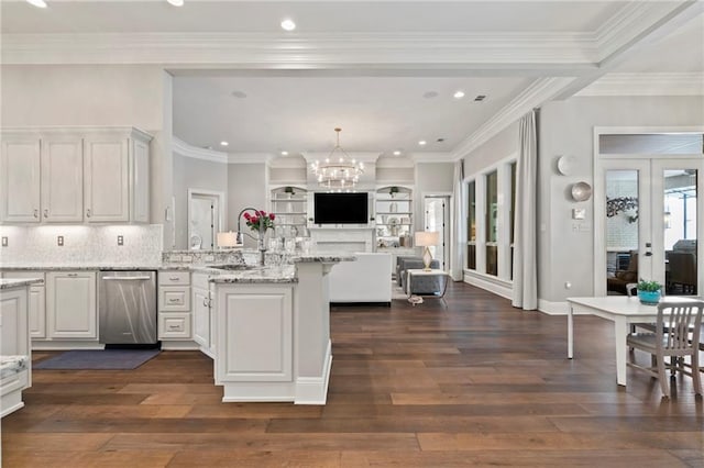 331 Memphis Trce, Covington, LA 70433 - kitchen featuring stainless steel dishwasher, a sink, a peninsula, open floor plan, and dark wood-style floors