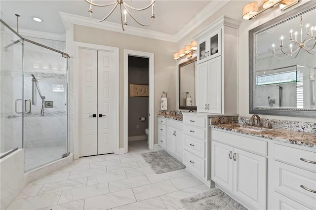 331 Memphis Trce, Covington, LA 70433 - bathroom with a chandelier, a stall shower, marble finish floors, vanity, and ornamental molding