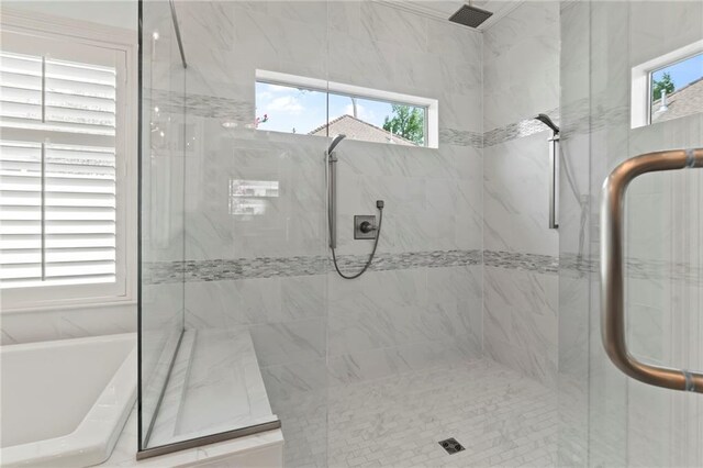 331 Memphis Trce, Covington, LA 70433 - bathroom with a marble finish shower, plenty of natural light, and a freestanding tub