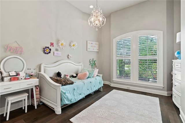 331 Memphis Trce, Covington, LA 70433 - bedroom featuring a chandelier, dark wood-style floors, and baseboards