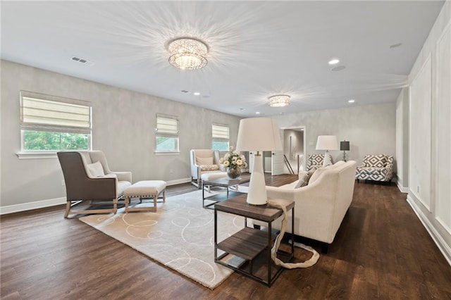 331 Memphis Trce, Covington, LA 70433 - living area featuring a chandelier, baseboards, dark wood-style flooring, and recessed lighting