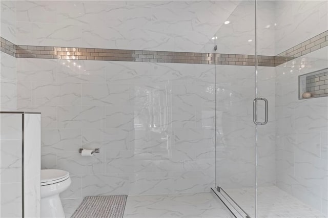 331 Memphis Trce, Covington, LA 70433 - bathroom featuring marble look tiles, toilet, and a marble finish shower