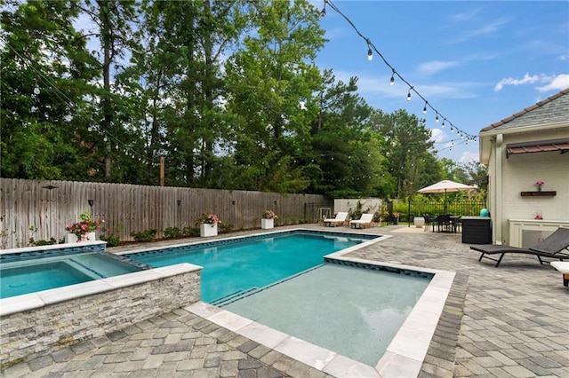 331 Memphis Trce, Covington, LA 70433 - view of swimming pool featuring an in-ground hot tub, a patio area, and a fenced backyard