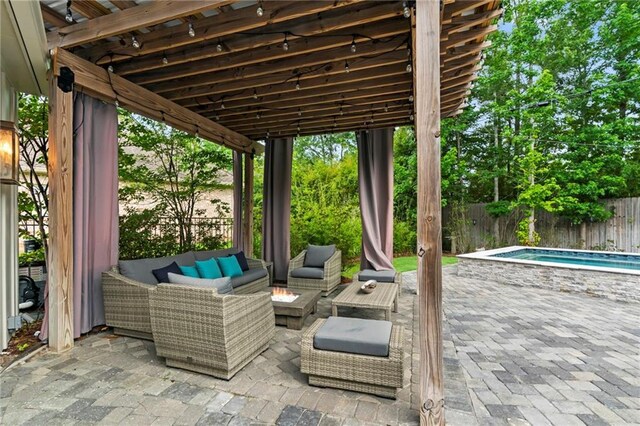331 Memphis Trce, Covington, LA 70433 - fenced backyard featuring an outdoor living space with a fire pit and a patio area