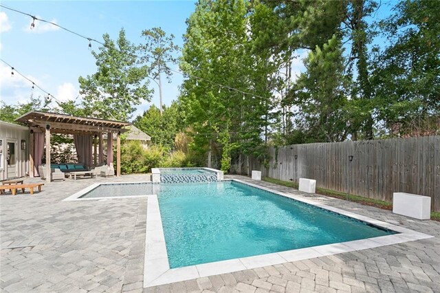 331 Memphis Trce, Covington, LA 70433 - fenced backyard featuring an outdoor living space with a fire pit and a patio