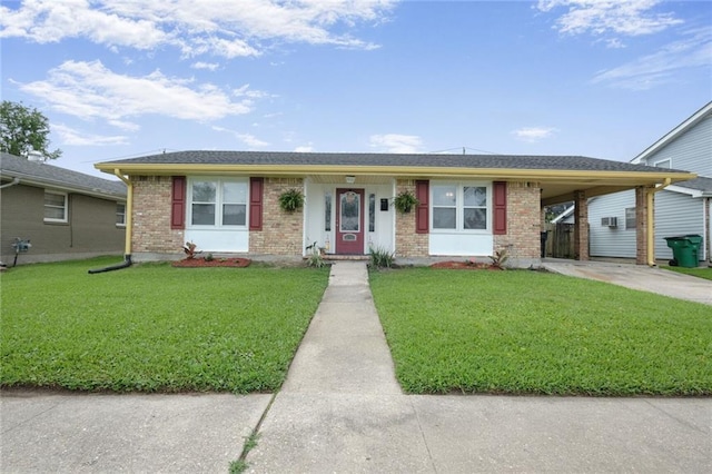 5908 York St, Metairie, LA 70003 - single story home featuring concrete driveway, brick siding, a front lawn, and a carport