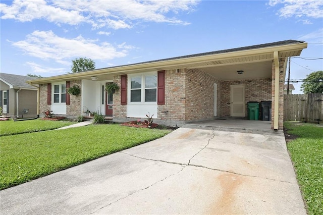 5908 York St, Metairie, LA 70003 - single story home with brick siding, driveway, and an attached carport