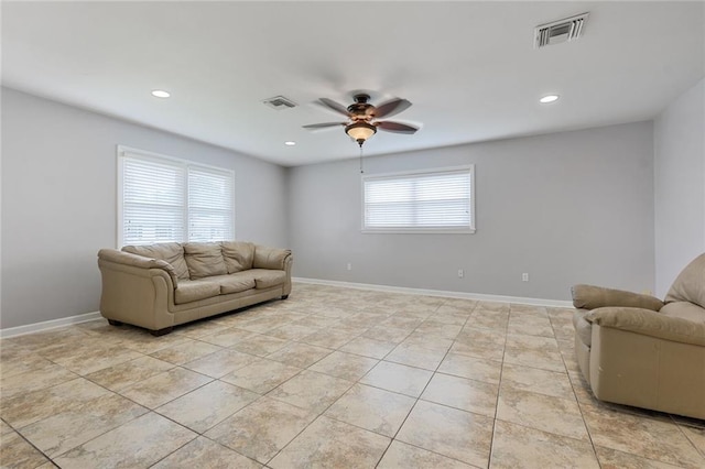 5908 York St, Metairie, LA 70003 - living area with a ceiling fan, recessed lighting, light tile patterned floors, and baseboards