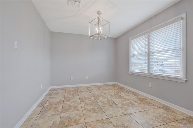 5908 York St, Metairie, LA 70003 - empty room with a chandelier and baseboards