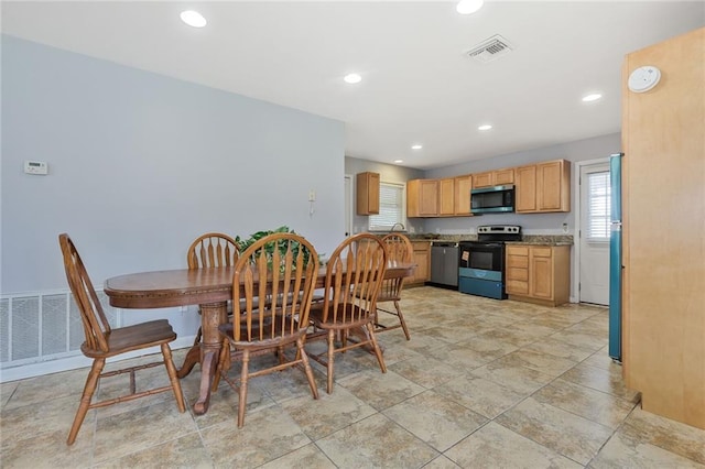 5908 York St, Metairie, LA 70003 - dining area with recessed lighting and light stone finish flooring