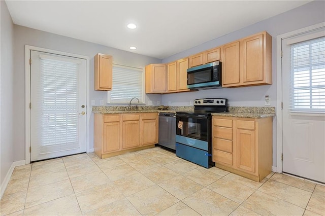 5908 York St, Metairie, LA 70003 - kitchen with stainless steel appliances, light brown cabinets, recessed lighting, and light stone countertops