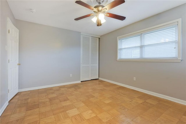 5908 York St, Metairie, LA 70003 - unfurnished bedroom with baseboards, a closet, and a ceiling fan