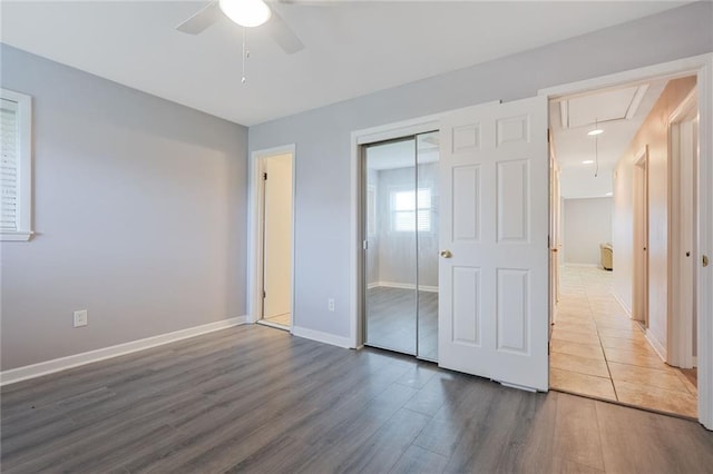 5908 York St, Metairie, LA 70003 - unfurnished bedroom with attic access, wood finished floors, a closet, and ceiling fan